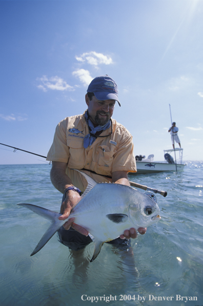 Saltwater flyfisherman holding permit.