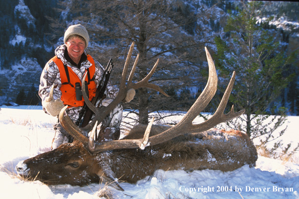 Big game hunter with bagged elk.