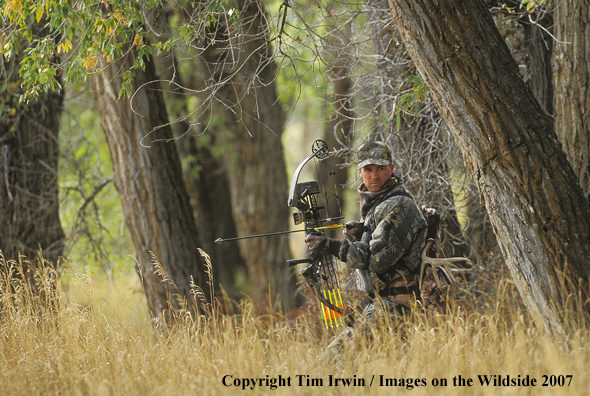 Bowhunter stalking target.