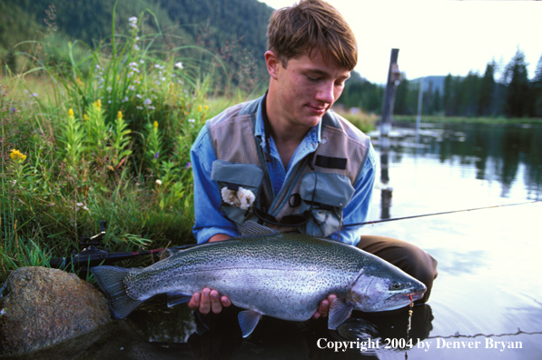 Fisherman holding rainbow trout