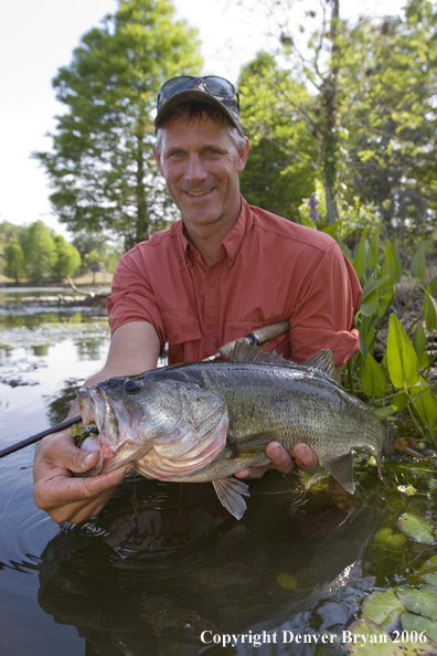 Fisherman with Largemouth Bass.  