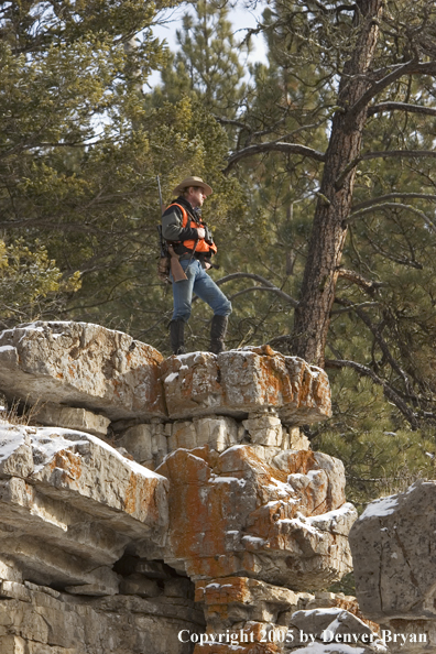 Big game hunter glassing for game.