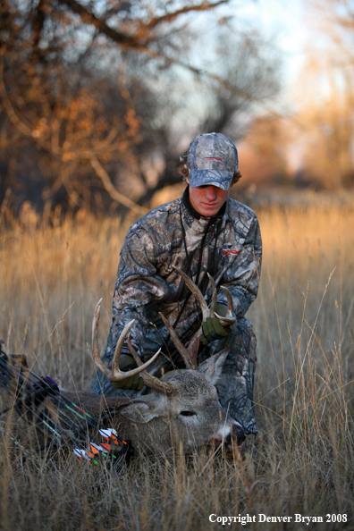 Bowhunter with Whitetail Deer