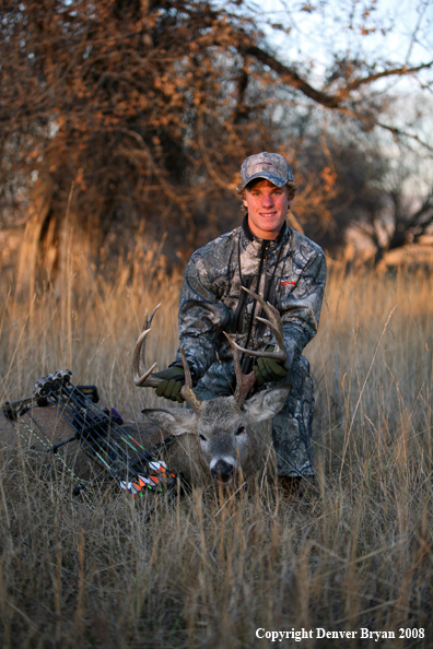 Bowhunter with Whitetail Deer