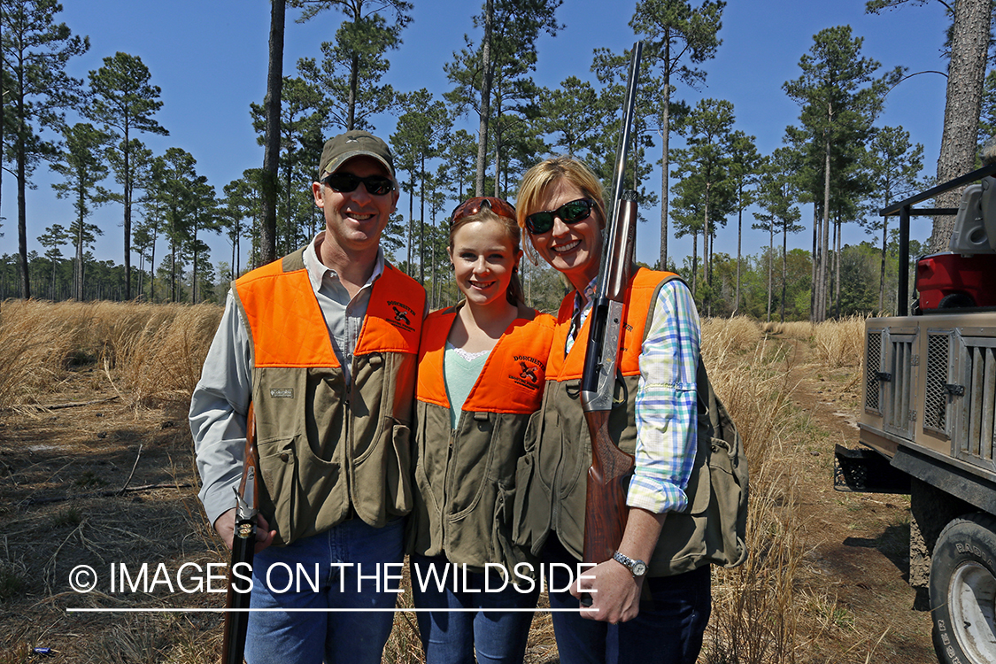 Child with parents hunting.