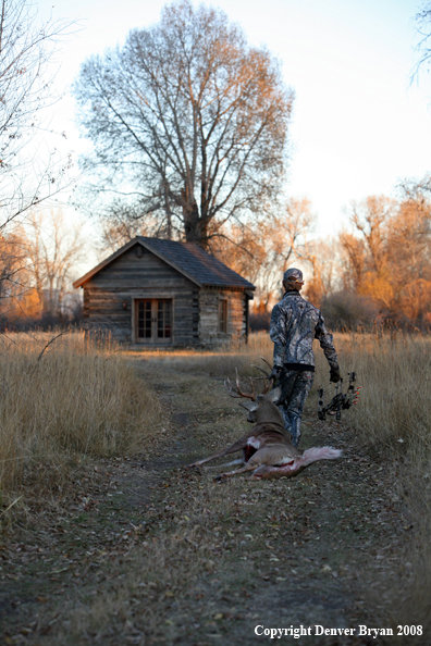 Bowhunter with Whitetail Deer