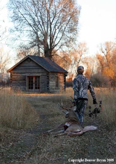Bowhunter with Whitetail Deer