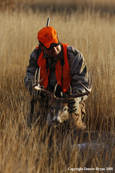 Hunter with Whitetail Deer