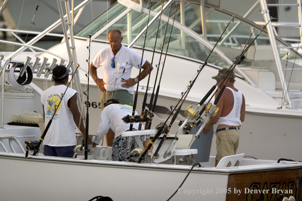 Deep sea fishing charter boats in marina.