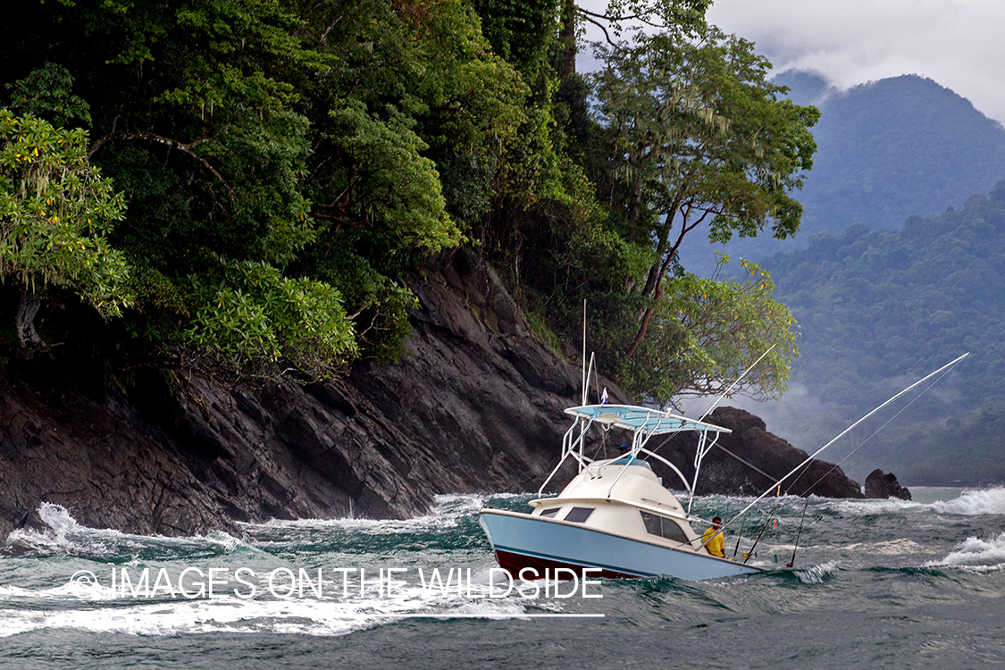 Fishermen on deep sea fishing boat.