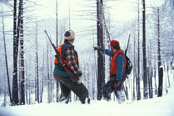 Big game hunters tracking game.