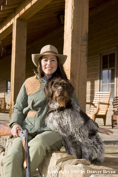 Woman hunter with German Wirehair.