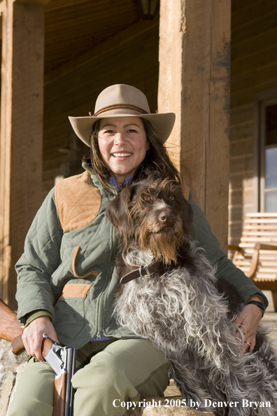 Woman hunter with German wirehair.