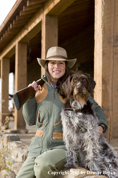 Woman hunter with German Wirehair.