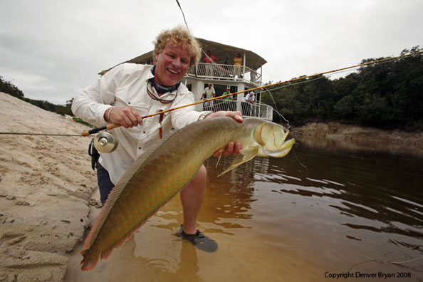 Flyfisherman with peacock bass