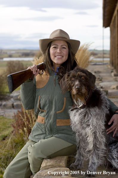 Woman hunter with German Wirehair.