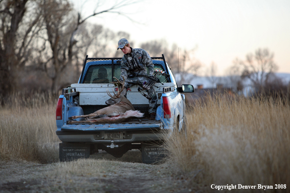 Bowhunter with Whitetail Deer