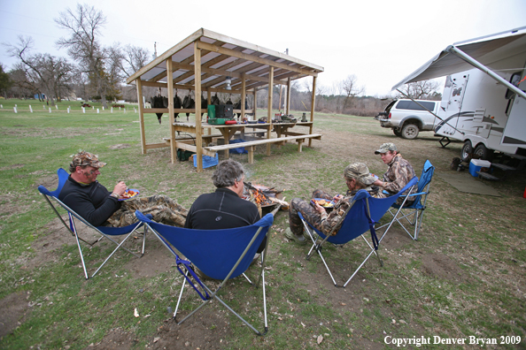 Hunters with bagged Merriam's turkeys
