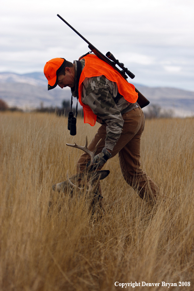 Hunter with Whitetail Deer
