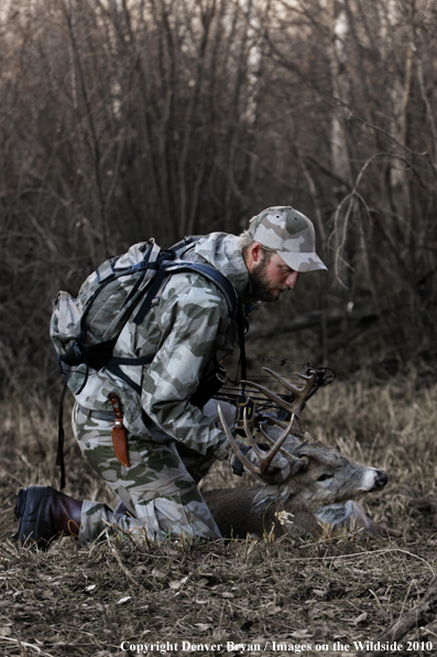 Bowhunter with bagged whitetail buck. (Original image # 11049-016.16D)