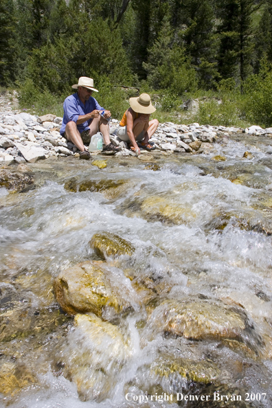 Couple enjoying river 