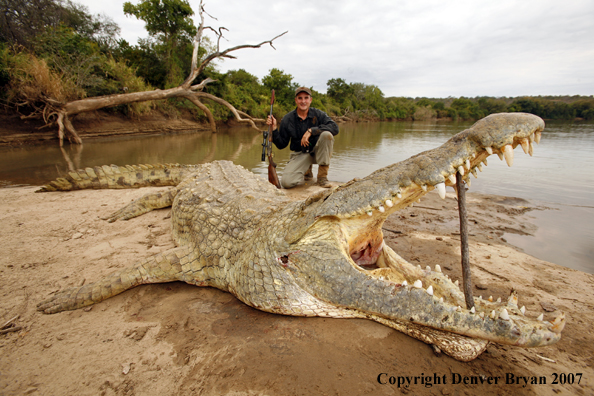 Hunter with bagged African crocodile