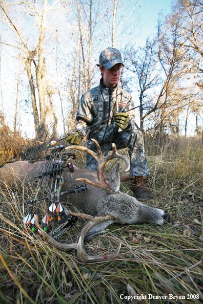 Bowhunter with Whitetail Deer