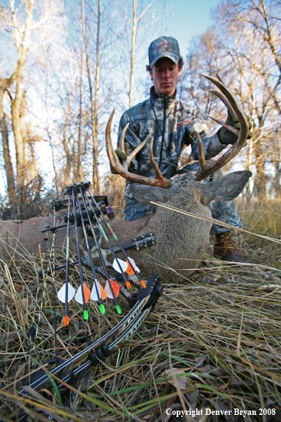 Bowhunter with Whitetail Deer