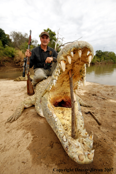 Hunter with bagged African crocodile
