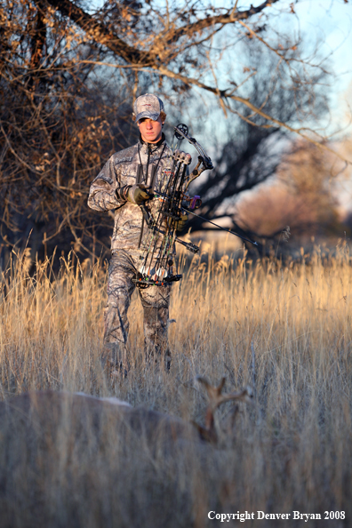 Bowhunter with Whitetail Deer