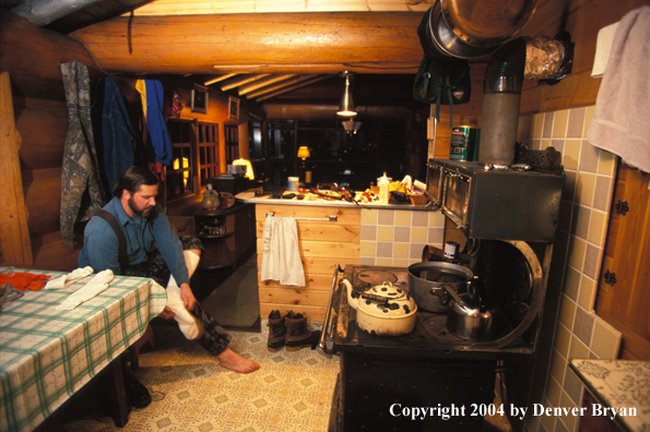 Big game hunter in cabin.