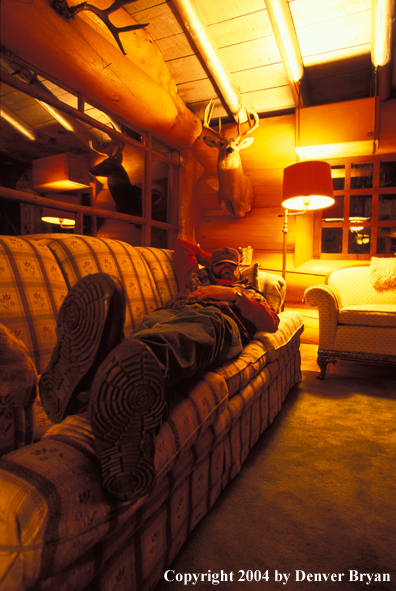 Big game hunter in cabin.