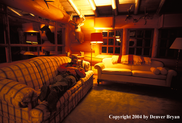 Big game hunter in cabin.