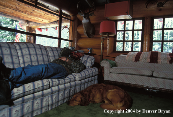 Big game hunter in cabin.