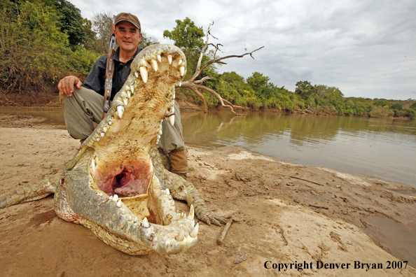 Hunter with bagged African crocodile