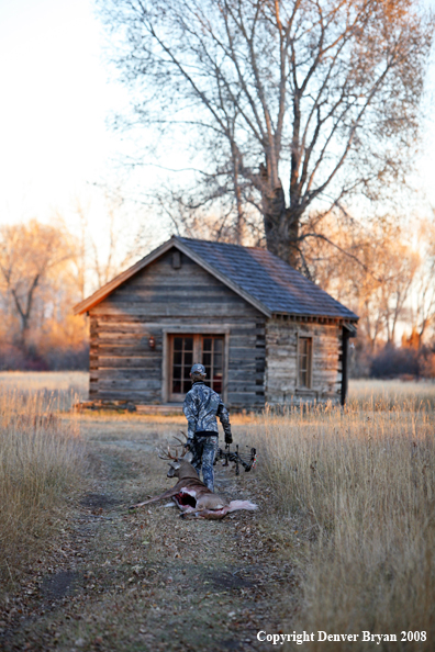Bowhunter with Whitetail Deer