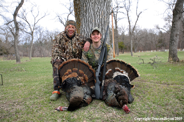 Hunters with bagged Merriam's turkeys