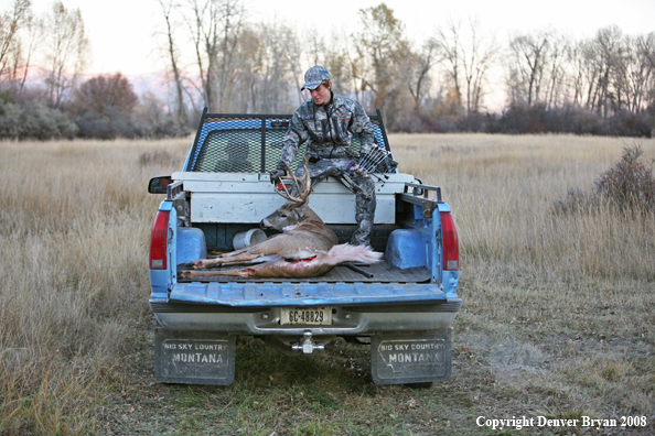 Bowhunter with Whitetail Deer