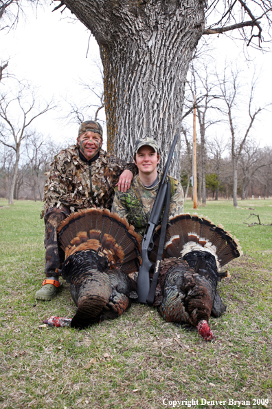 Hunters with bagged Merriam's turkeys