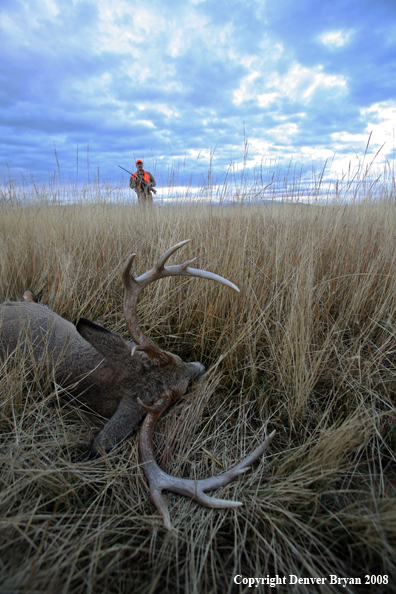 Hunter with Whitetail Deer