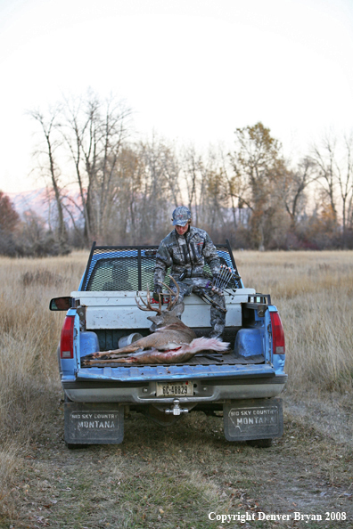 Bowhunter with Whitetail Deer