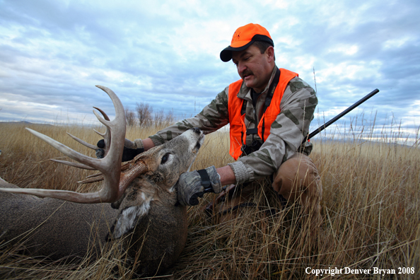 Hunter with Whitetail Deer