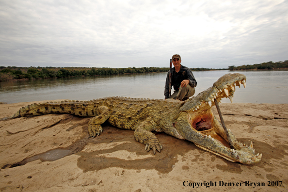 Hunter with bagged African crocodile