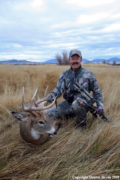 Bowhunter with Whitetail Deer