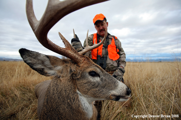 Hunter with Whitetail Deer