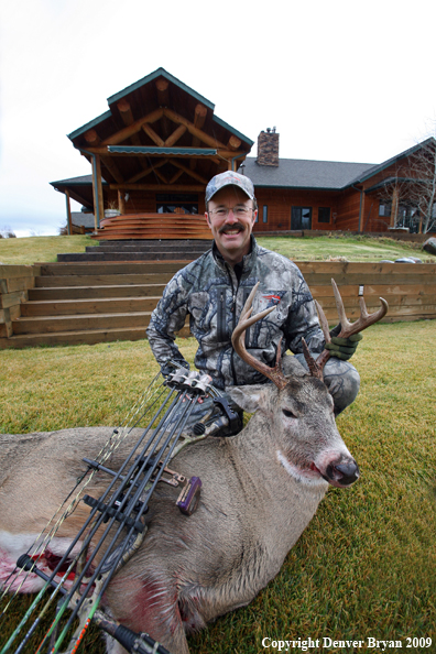 Bowhunter with Whitetail Deer