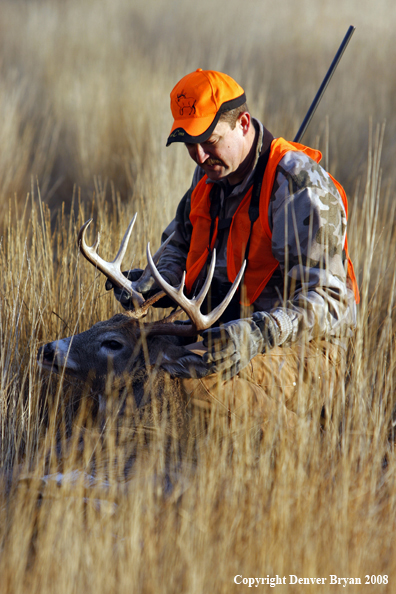 Hunter with Whitetail Deer