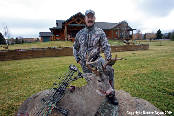 Bowhunter with Whitetail Deer