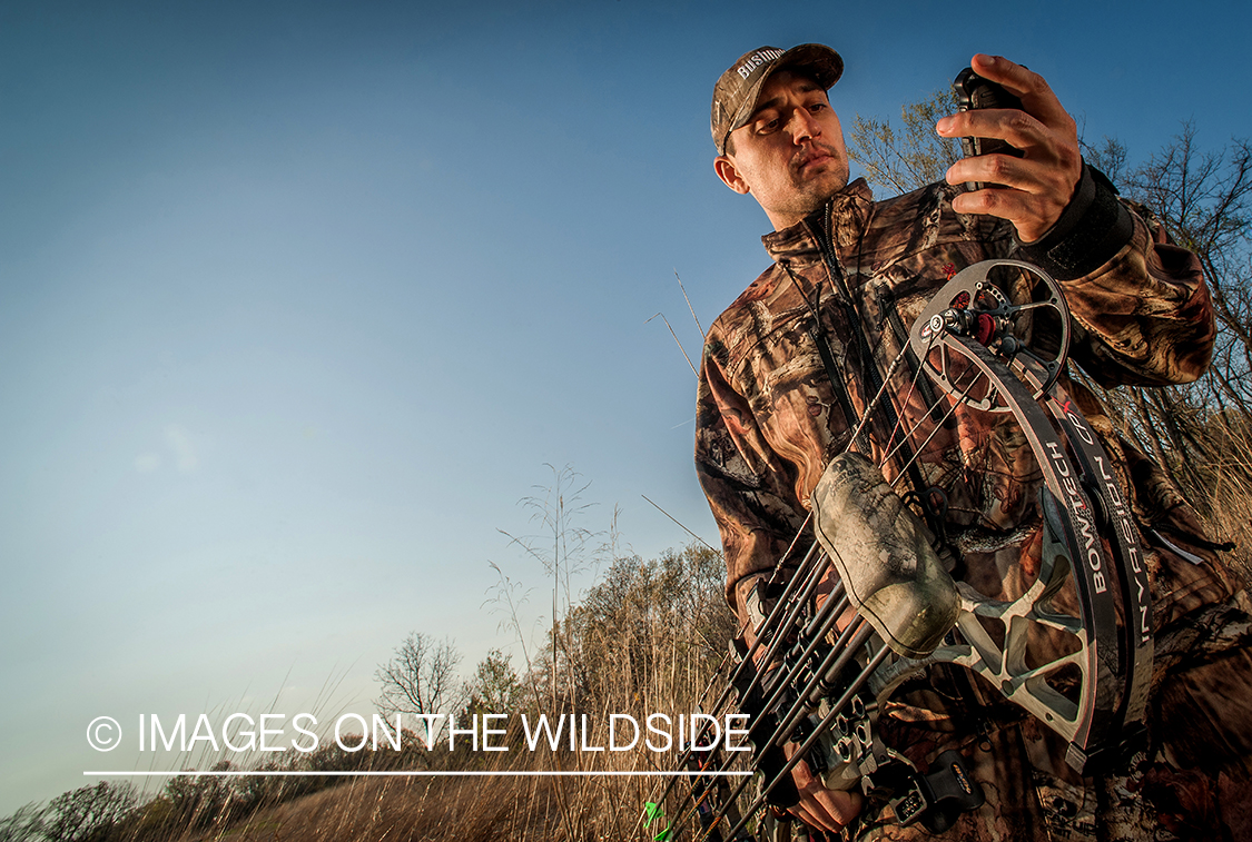 Bowhunter using GPS.