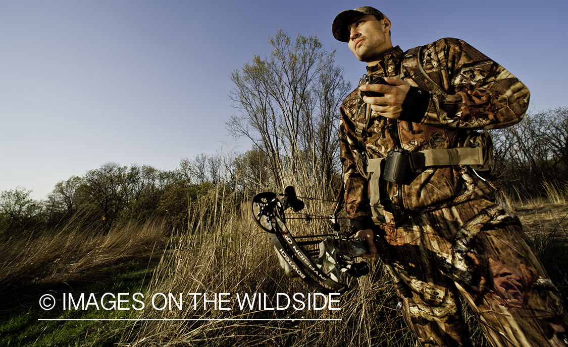 Bowhunter using GPS.